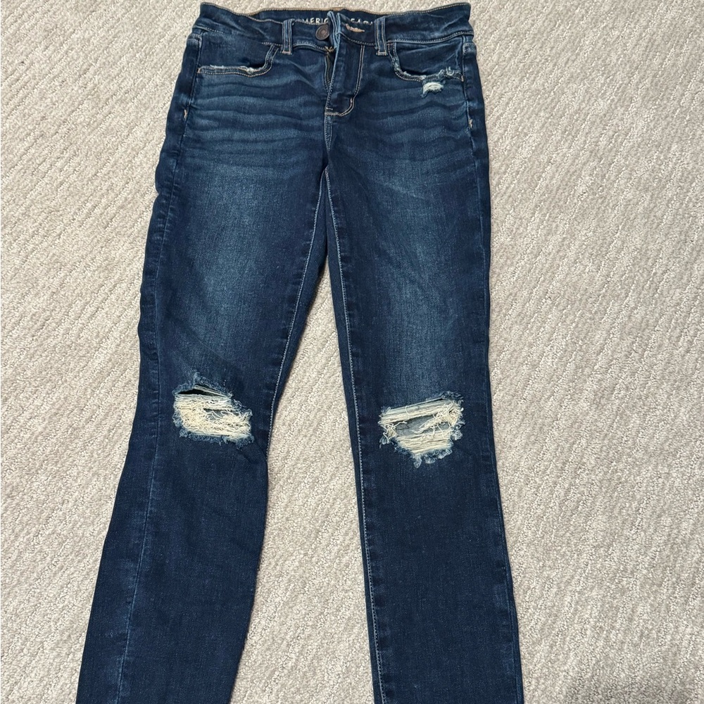American Eagle Outfitters Dark Blue Distressed Hi-Rise Jegging. size 4 regular